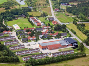 8 person holiday home on a holiday park in Bl vand
